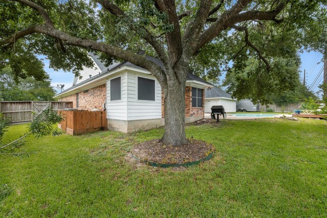 24418 Okehampton Dr, Tomball, TX 77375 - view of home's exterior with a fenced backyard