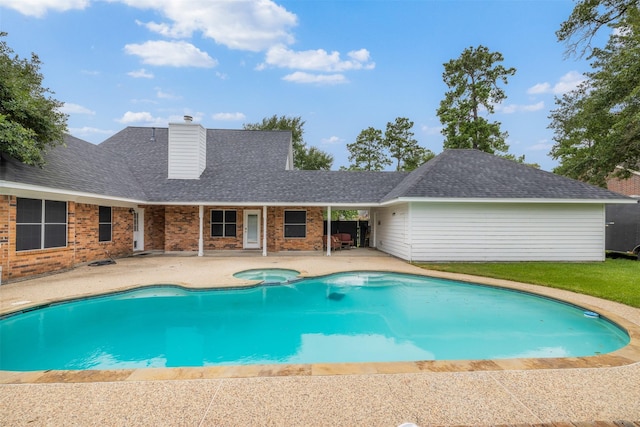 24418 Okehampton Dr, Tomball, TX 77375 - view of swimming pool with a patio area and a pool with connected hot tub