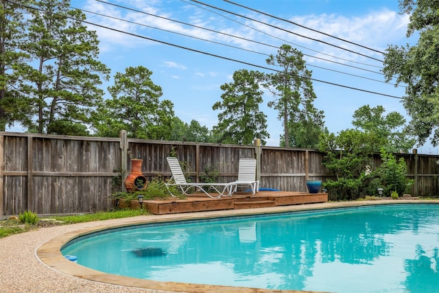 24418 Okehampton Dr, Tomball, TX 77375 - view of pool with a fenced backyard and a wooden deck
