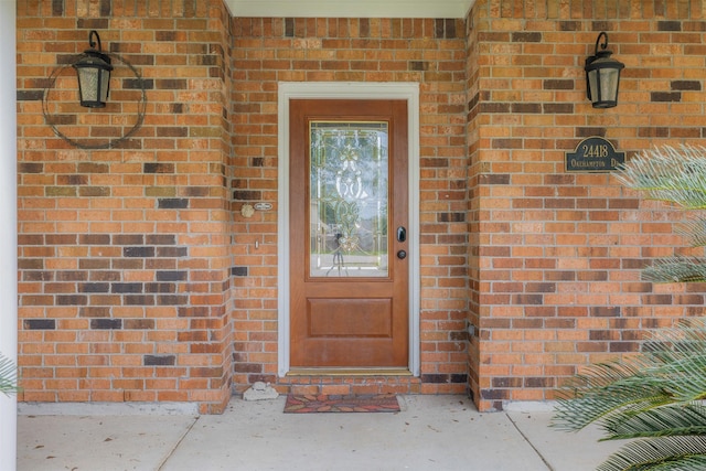 24418 Okehampton Dr, Tomball, TX 77375 - property entrance featuring brick siding