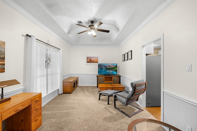 24418 Okehampton Dr, Tomball, TX 77375 - living area with a tray ceiling, a ceiling fan, light carpet, and ornamental molding