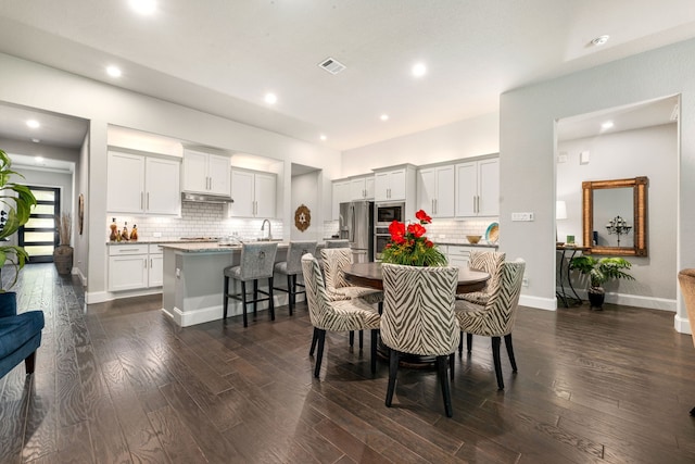 27688 Vivace Dr, Spring, TX 77386 - dining area with dark wood-style flooring and recessed lighting