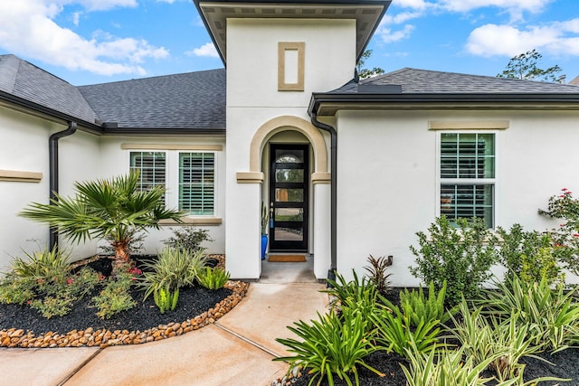 27688 Vivace Dr, Spring, TX 77386 - doorway to property with stucco siding and roof with shingles