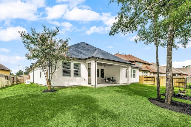 27688 Vivace Dr, Spring, TX 77386 - back of property featuring a ceiling fan, stucco siding, a fenced backyard, and a patio