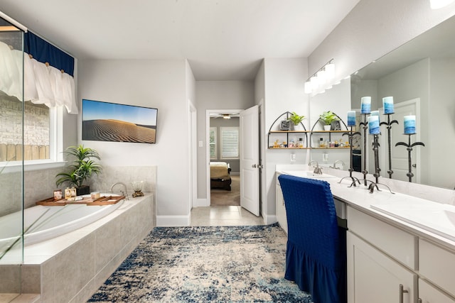 27688 Vivace Dr, Spring, TX 77386 - ensuite bathroom with double vanity, a garden tub, tile patterned flooring, and ceiling fan
