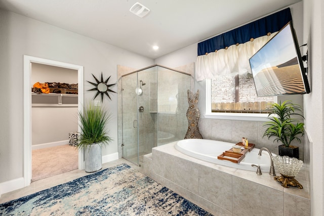27688 Vivace Dr, Spring, TX 77386 - bathroom featuring a bath, a shower stall, a spacious closet, and tile patterned flooring