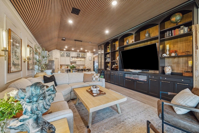 7203 Mayapple Grove Ln, Katy, TX 77493 - living area with light wood-style floors and built in shelves