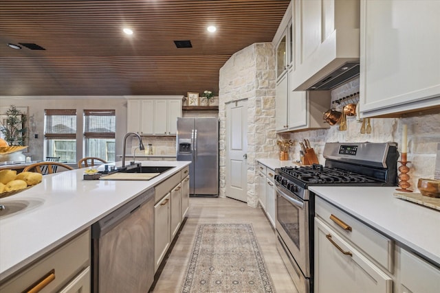 7203 Mayapple Grove Ln, Katy, TX 77493 - kitchen with appliances with stainless steel finishes, wooden ceiling, light countertops, extractor fan, and light wood-style floors