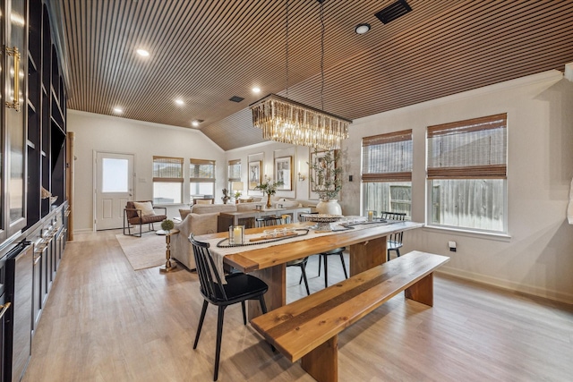7203 Mayapple Grove Ln, Katy, TX 77493 - dining area featuring a chandelier, light wood-type flooring, recessed lighting, and vaulted ceiling