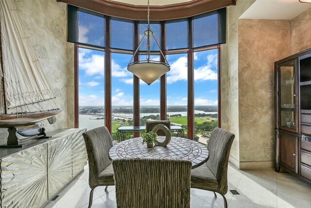 4821 Nasa Pkwy Unit 18W, Seabrook, TX 77586 - dining area with a water view and a high ceiling