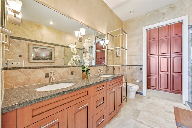 4821 Nasa Pkwy Unit 18W, Seabrook, TX 77586 - bathroom with double vanity, tile walls, and tasteful backsplash