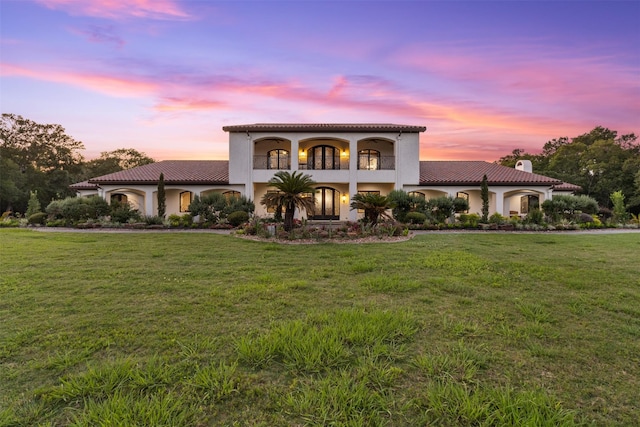 19216 Fm 442nd Rd, Needville, TX 77461 - mediterranean / spanish-style home featuring a tile roof, a chimney, a yard, a balcony, and stucco siding