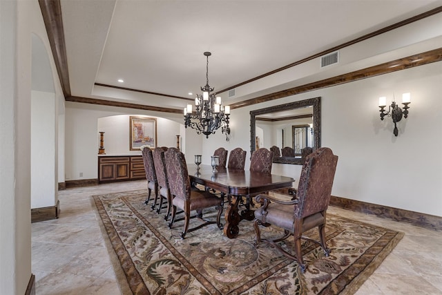 19216 Fm 442nd Rd, Needville, TX 77461 - dining room featuring arched walkways, a chandelier, crown molding, a raised ceiling, and recessed lighting