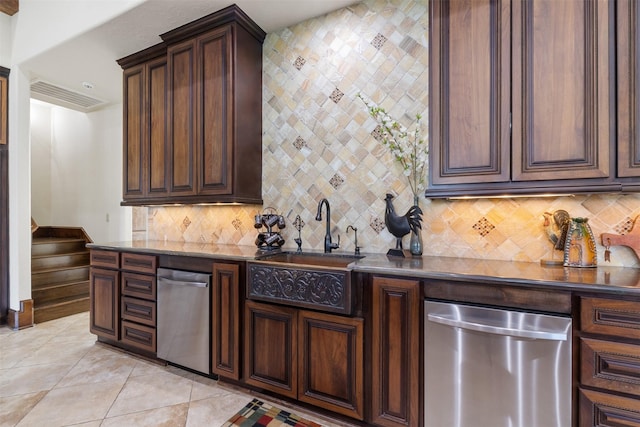 19216 Fm 442nd Rd, Needville, TX 77461 - kitchen featuring dishwasher, backsplash, dark brown cabinetry, and light tile patterned floors