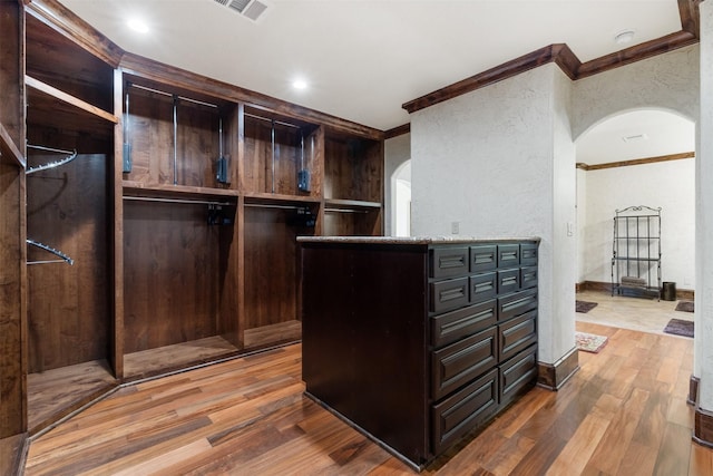 19216 Fm 442nd Rd, Needville, TX 77461 - spacious closet with arched walkways and wood finished floors