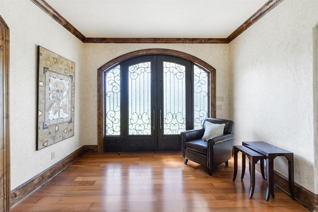 19216 Fm 442nd Rd, Needville, TX 77461 - foyer entrance with a textured wall, ornamental molding, french doors, wood-type flooring, and healthy amount of natural light