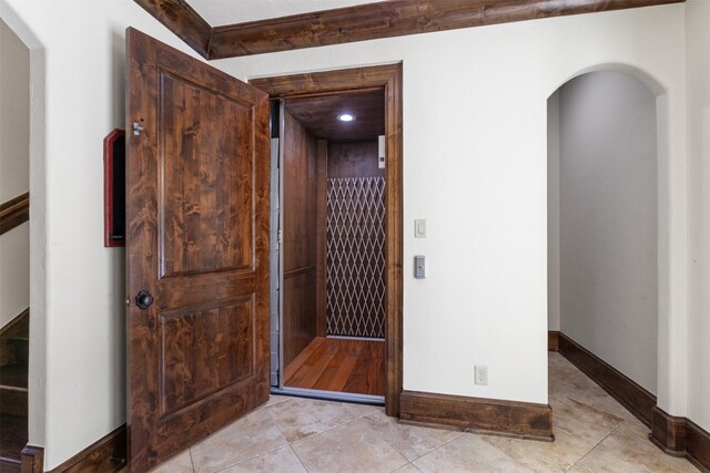 19216 Fm 442nd Rd, Needville, TX 77461 - corridor with arched walkways, light tile patterned flooring, and recessed lighting
