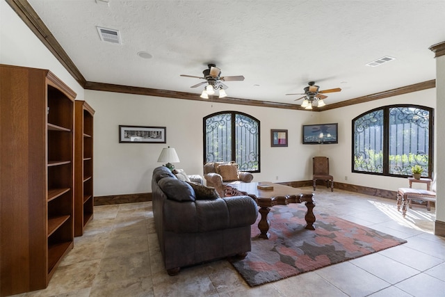 19216 Fm 442nd Rd, Needville, TX 77461 - living area with crown molding, ceiling fan, light tile patterned floors, and a textured ceiling