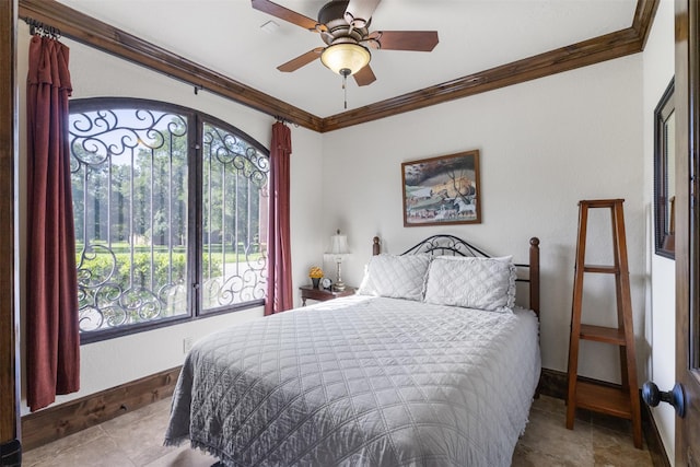 19216 Fm 442nd Rd, Needville, TX 77461 - bedroom with ornamental molding, stone finish floors, and a ceiling fan