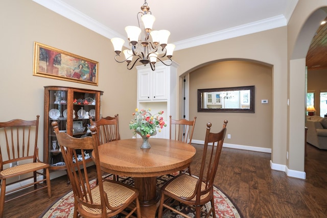 16338 Acapulco Dr, Jersey Village, TX 77040 - dining room with arched walkways, ornamental molding, dark wood-style floors, and a chandelier