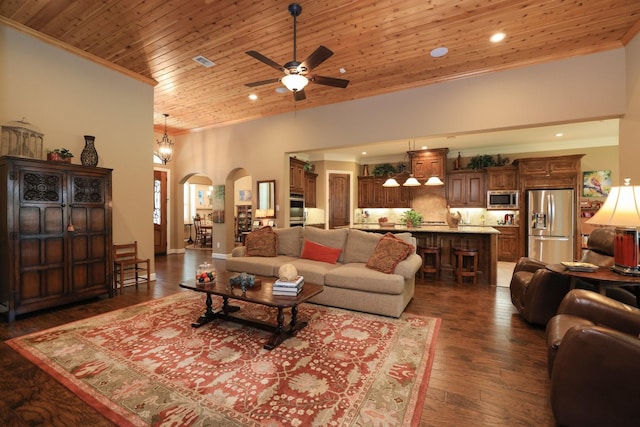16338 Acapulco Dr, Jersey Village, TX 77040 - living room with ornamental molding, arched walkways, wooden ceiling, ceiling fan, and dark wood-style floors