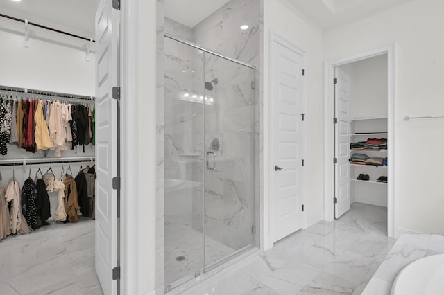 5212 Liberty Cove Dr, Spring, TX 77386 - bathroom with marble look tiles, a marble finish shower, and a walk in closet