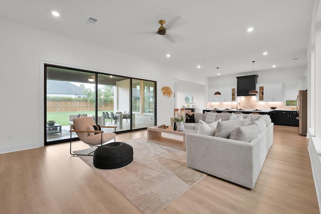 5212 Liberty Cove Dr, Spring, TX 77386 - living room featuring ceiling fan, light wood-style flooring, and recessed lighting