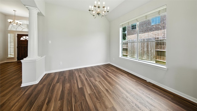 3119 Emory Oak Ln, Pearland, TX 77584 - unfurnished dining area with a chandelier, wood finished floors, ornate columns, and vaulted ceiling