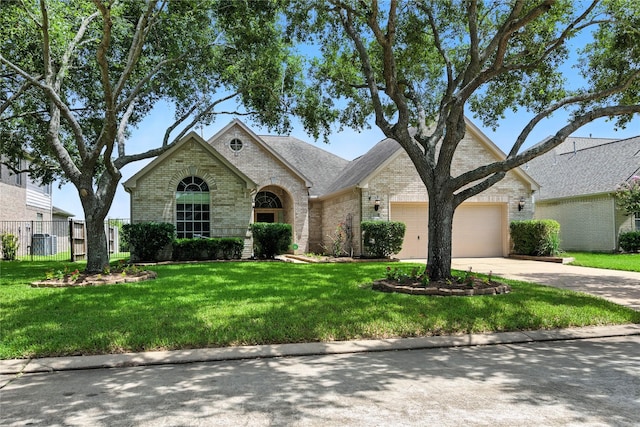 3119 Emory Oak Ln, Pearland, TX 77584 - view of front of home with brick siding, an attached garage, and concrete driveway