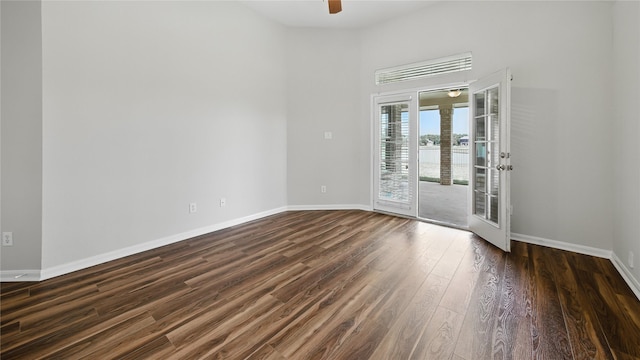 3119 Emory Oak Ln, Pearland, TX 77584 - spare room with dark wood-style floors, ceiling fan, and a towering ceiling
