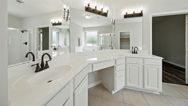 3119 Emory Oak Ln, Pearland, TX 77584 - bathroom with a stall shower, double vanity, and tile patterned flooring