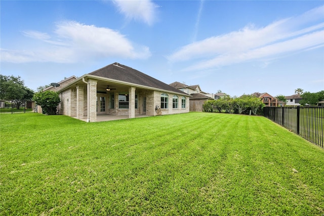 3119 Emory Oak Ln, Pearland, TX 77584 - rear view of property featuring a patio area, a ceiling fan, a fenced backyard, and brick siding