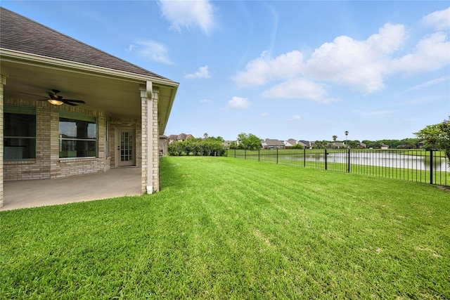 3119 Emory Oak Ln, Pearland, TX 77584 - view of yard featuring a water view, a ceiling fan, and a patio area