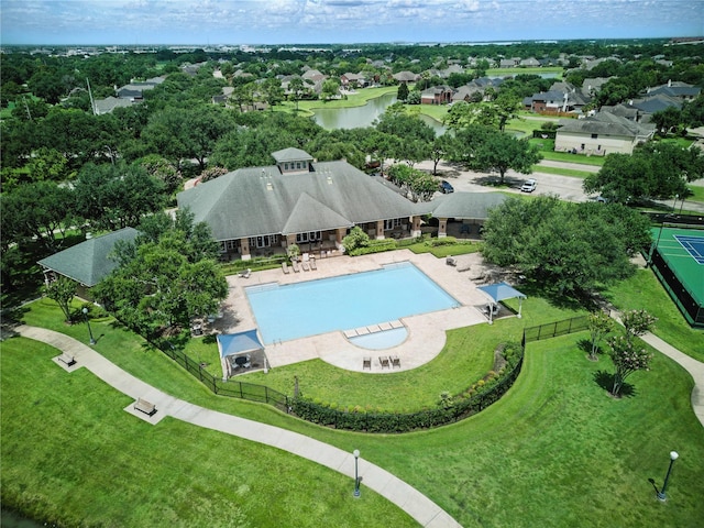 3119 Emory Oak Ln, Pearland, TX 77584 - aerial perspective of suburban area with a pool and a nearby body of water