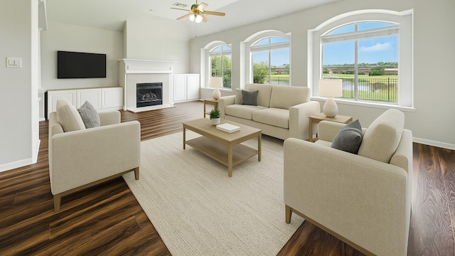 3119 Emory Oak Ln, Pearland, TX 77584 - living area with dark wood-style flooring, ceiling fan, a fireplace, and a water view