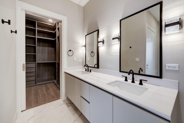 1711 Allen Pkwy Unit 2203, Houston, TX 77019 - bathroom with double vanity, marble look tiles, and a walk in closet