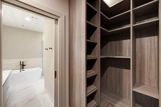 1711 Allen Pkwy Unit 2203, Houston, TX 77019 - spacious closet featuring light marble finish flooring
