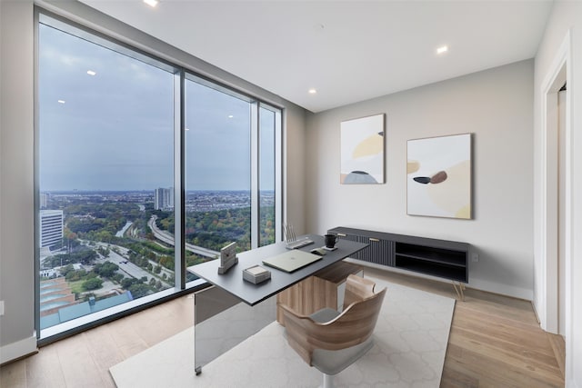 1711 Allen Pkwy Unit 2203, Houston, TX 77019 - office area featuring light wood-type flooring, recessed lighting, and a wall of windows
