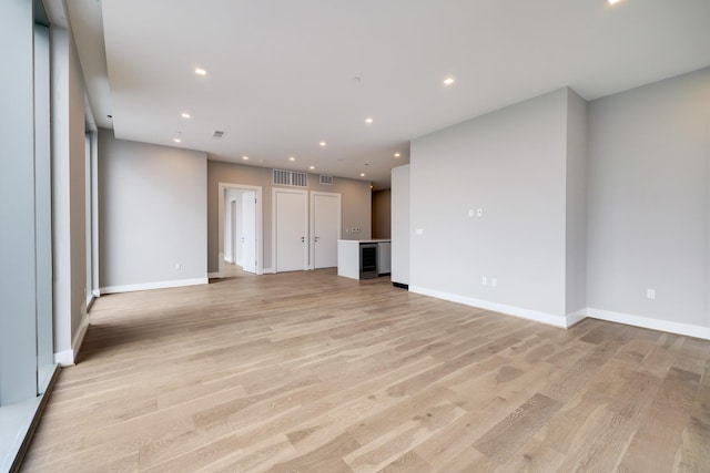 1711 Allen Pkwy Unit 2203, Houston, TX 77019 - unfurnished living room featuring light wood finished floors and recessed lighting