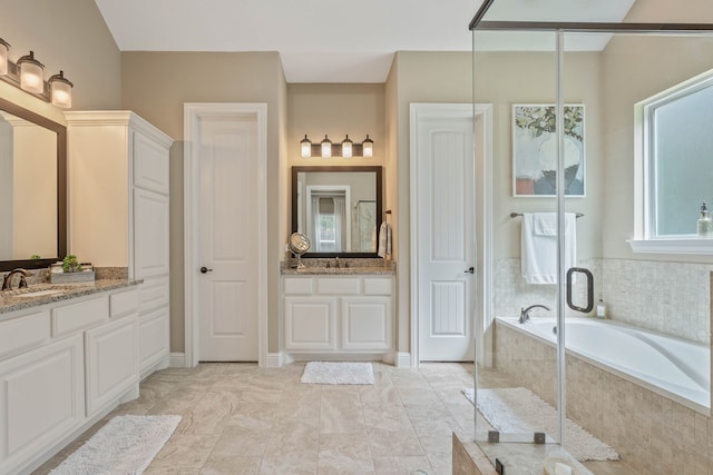 115 Dedication Trl, Huntsville, TX 77340 - bathroom with a garden tub, two vanities, and a shower stall