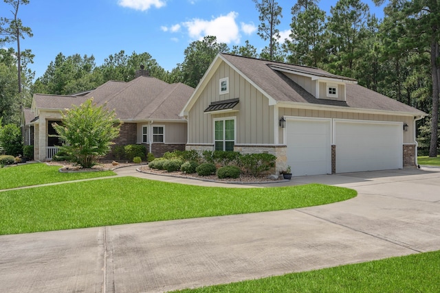 115 Dedication Trl, Huntsville, TX 77340 - view of front of property with concrete driveway, board and batten siding, a garage, a front lawn, and a shingled roof