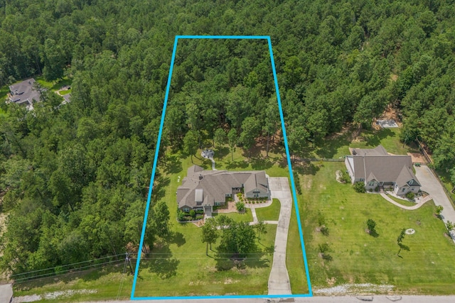 115 Dedication Trl, Huntsville, TX 77340 - aerial view of property and surrounding area featuring a heavily wooded area and property boundaries highlighted