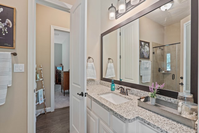 115 Dedication Trl, Huntsville, TX 77340 - full bathroom with wood finished floors, vanity, and a stall shower