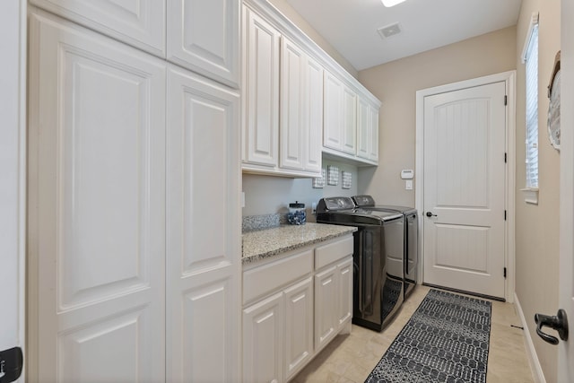 115 Dedication Trl, Huntsville, TX 77340 - laundry area featuring cabinet space and washer and clothes dryer