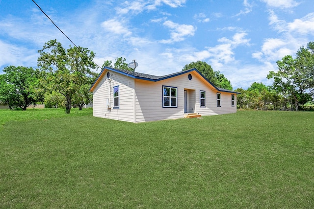 1030 San Felipe Rd, Sealy, TX 77474 - back of house with a lawn