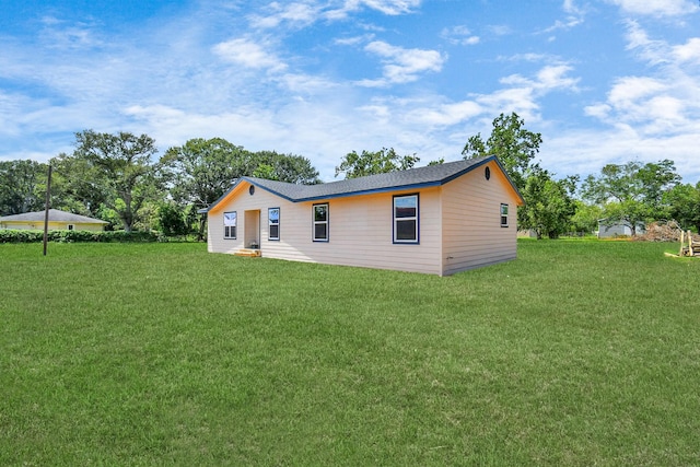 1030 San Felipe Rd, Sealy, TX 77474 - rear view of house with a yard