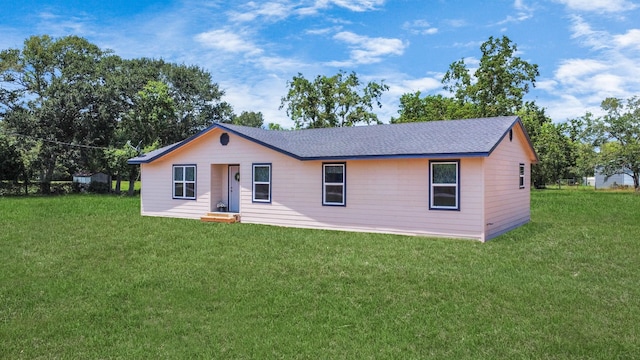 1030 San Felipe Rd, Sealy, TX 77474 - view of front of house featuring a front lawn and a shingled roof