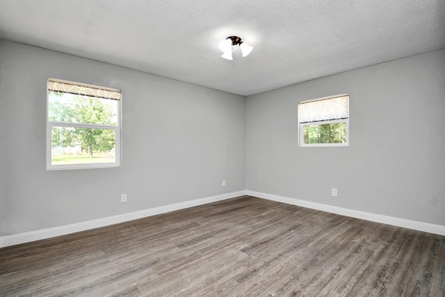 1030 San Felipe Rd, Sealy, TX 77474 - empty room featuring wood finished floors and a textured ceiling