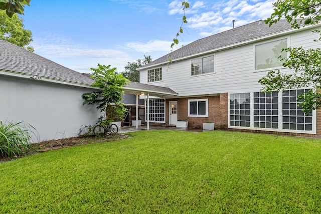 4814 Kirkwall Dr, Sugar Land, TX 77479 - rear view of property featuring a patio, a yard, and roof with shingles