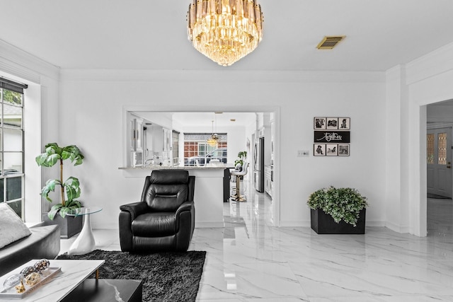 4814 Kirkwall Dr, Sugar Land, TX 77479 - living area with a chandelier, light marble finish floors, and crown molding